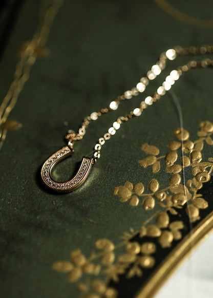 Solid gold horseshoe necklace